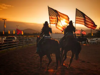 People riding horses at a fair